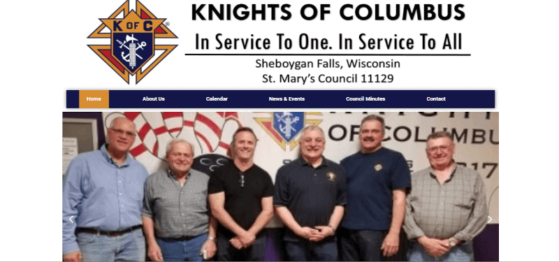6 men standing in front of a banner